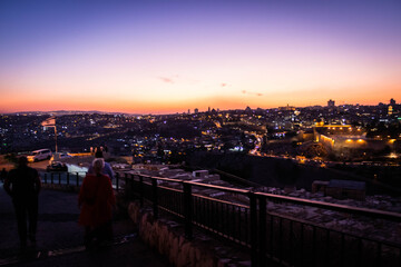 panorama of jerusalem from 
Jewish cemetery on the Olive Hill with a mosque dome on the rock in the light of the setting sun