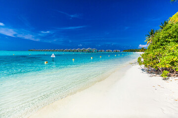 White sandy beach in Maldives with amazing blue lagoon