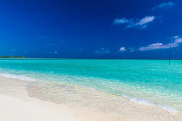 White sandy beach in Maldives with amazing blue lagoon