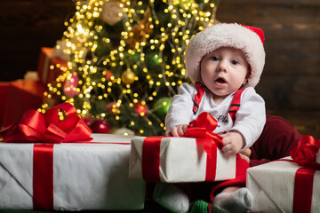 Fototapeta na wymiar Funny attractive baby in Christmas costume. Kids New Year.