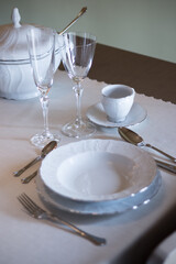 Set of porcelain tableware,  prepared on a table in a modern restaurant.