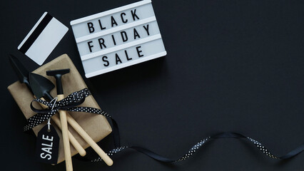 Banner concept for Black Friday celebration,lettering.White board with text BLACK FRIDAY SALE,gift...