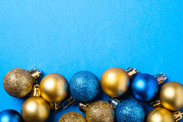 Christmas composition. Blue and golden ornament and baubles decorations. Copy space