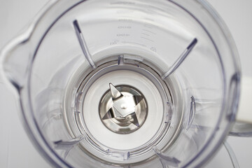 Plastic blender with steel knives, top view, selective focus. Milkshake