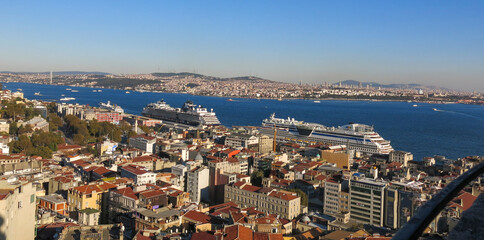 Fototapeta na wymiar Ariel View of Istanbul which is Turkey's most populous city as well as its cultural and financial hub. Two huge cruise ships parked near Tophane, Karakoy port.