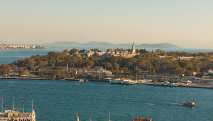 Naklejka premium Topkapi Palace near Eminonu in Istanbul. The prince islands are visible in the backside of Topkapi Palace. Ferries are passing. Istanbul Golden Horn View with Topkapi Palace.
