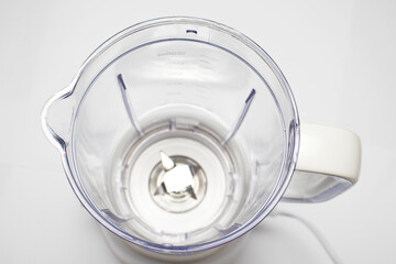 Plastic blender with steel knives, top view, selective focus. Milkshake