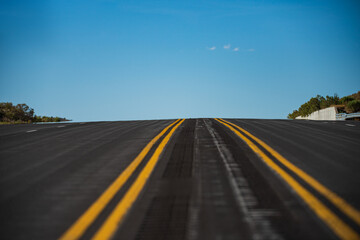 Landscape scene and sunrise above road. Panoramic picture of a scenic road, USA.