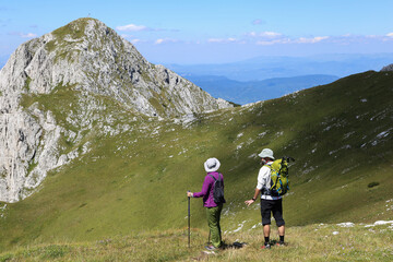 couple hiking and enjoying view