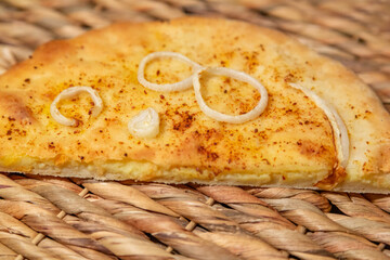 Freshly cooked delicious closed pie with hot cheese inside