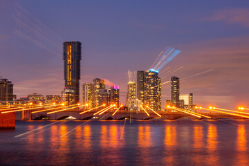 Miami skyline. Miami south beach street view with water reflections at night.