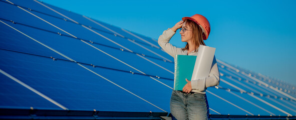 Businesswomen working on checking equipment at solar power plant with tablet checklist, woman...