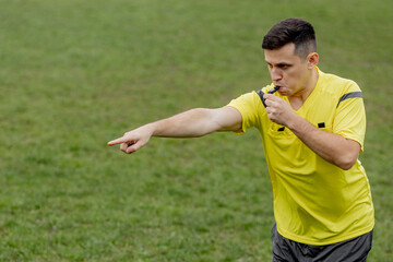 Referee showing on penalty while gaming. Concept of sport, rules violation, controversial issues,...