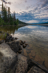 Beautiful reflection in lake with trees from from Pyramid Lake near Jasper, Alberta, Canada