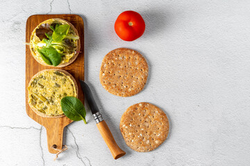Top view of vegan burgers with lettuce and spinach. Wholemeal bread. Vegetarian diet concept.
