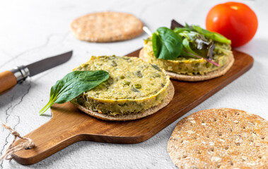 Vegan chickpeas burgers with arugula and spinach. Wholemeal bread. Plant based diet concept.