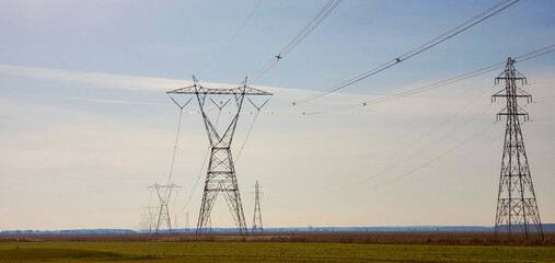 Farmland after plowing with electric pylon in Quebec, Canada