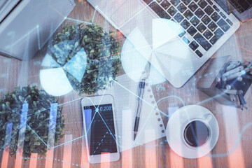 Multi exposure of financial chart hologram over desktop with phone. Top view. Mobile trade platform...