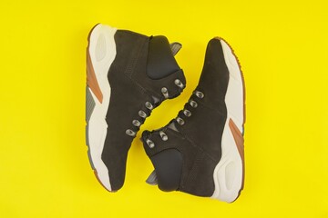 New womens leather black waterproof hiking winter autumn boots on yellow background