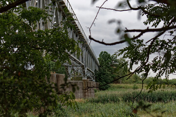 Abandoned steel railway bridge over the river.
