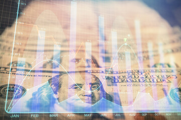 Double exposure of forex graph drawing over us dollars bill background. Concept of financial markets.