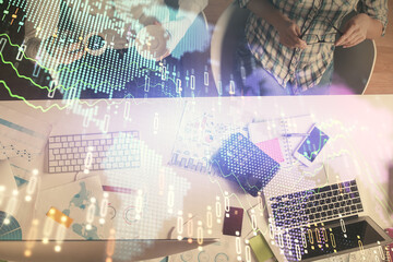 Double exposure of man and woman working together and financial chart hologram drawing. market analysis concept. Computer background. Top View.