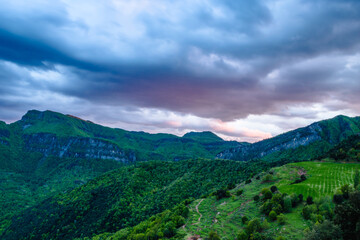 Sunset into the mountains (Peak of Puigsacalm, Catalonia province, Garrotxa, Spain)