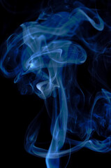 Smoke streaming on a black background close-up