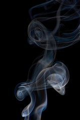 Obraz premium Smoke streaming on a black background close-up