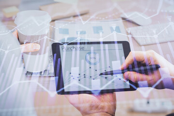 Double exposure of man's hands holding and using a phone and financial chart drawing. Market analysis concept.