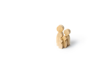 Wooden figurines of the family on a white background. Family values and health. Adoption and...