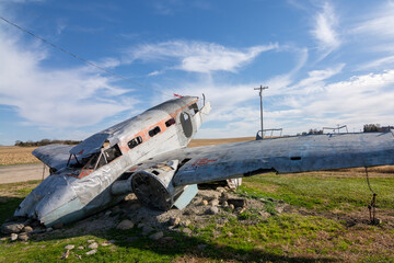 Crashed passenger plane in the afternoon sun.  Norway, Illinois, USA.