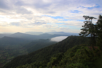 layers of mountains with fog