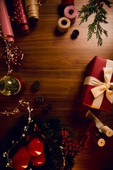 Christmas present with white bow-knot and holiday lights on background. Precedent decoration concept..