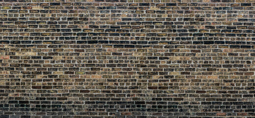 Old Chicago black, grey, brown, dark red bricks wall background 