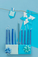 religion image of jewish holiday Hanukkah background with gifts and candles.