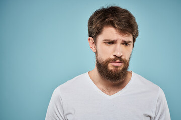 Bearded man emotions white t-shirt lifestyle gestures with hands blue backgrounds