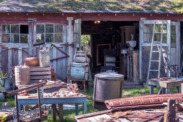 barn sale with lots of rustic treasures on display for a bargain hunter