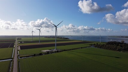 Aerial view of deserted road, nature, windmills and views over river and canal.