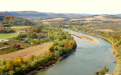 The aerial view of the Susquehanna River surrounded by striking color of fall foliage near Wyalusing, Pennsylvania, U.S