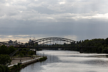Bridge on the river and cloudy sky