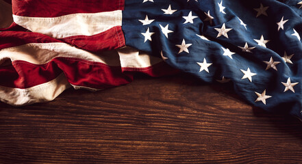 Happy Veterans Day concept. Vintage American flags against old wooden  background. November 11.