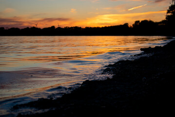 Waves Crashing on Shore During Sunset