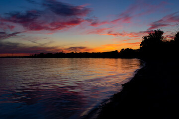 Fototapeta na wymiar Colourful Sunset on Lake