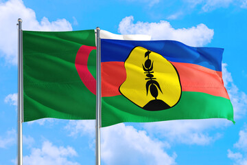 New Caledonia and Algeria national flag waving in the windy deep blue sky. Diplomacy and international relations concept.