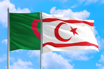 Northern Cyprus and Algeria national flag waving in the windy deep blue sky. Diplomacy and...