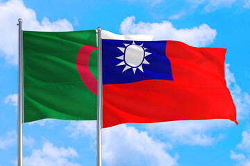 Taiwan and Algeria national flag waving in the windy deep blue sky. Diplomacy and international relations concept.