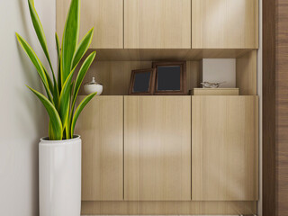 There are wardrobes, cupboards, mirrors and green plants in the study of the family house.