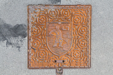 square sewer manhole with metallurgy worker in Slovenia