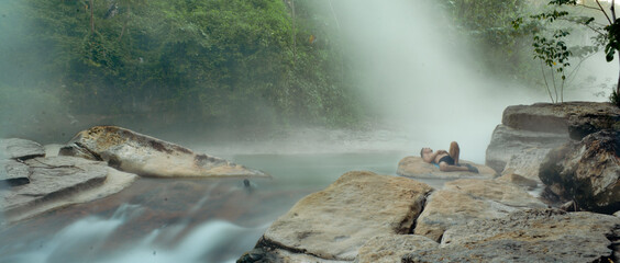 Mayantuyacu boiling river, hot springs with relaxed person receiving steam bath. In Honoria,...